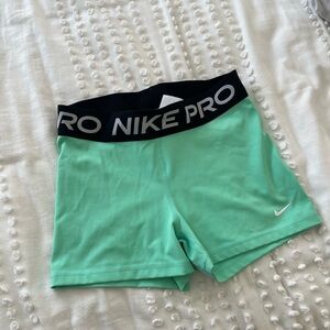 Teal Nike Pros Size M